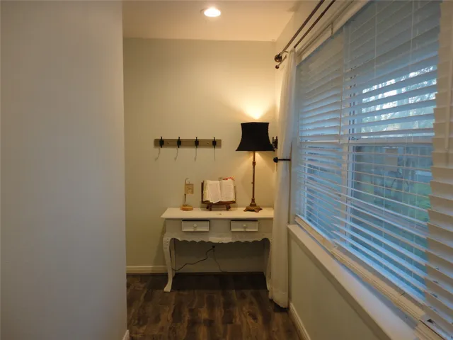 a room with a sink and a mirror