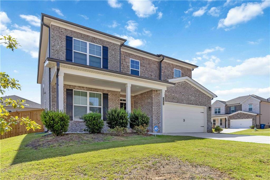 a front view of a house with a yard
