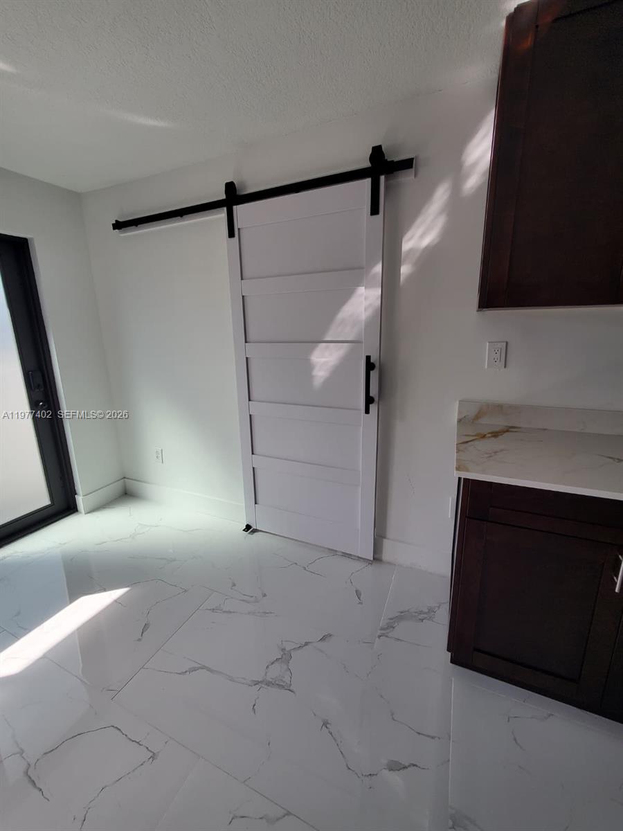 920 Southeast 8th Street, Unit 1 Hialeah, FL 33010 - Photo 8 of 14 Door for bedroom entry