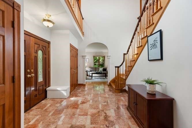 55 Meriam Street Lexington, MA 02420 - Photo 29 of 37 a view of an entryway with wooden floor and a livingroom view