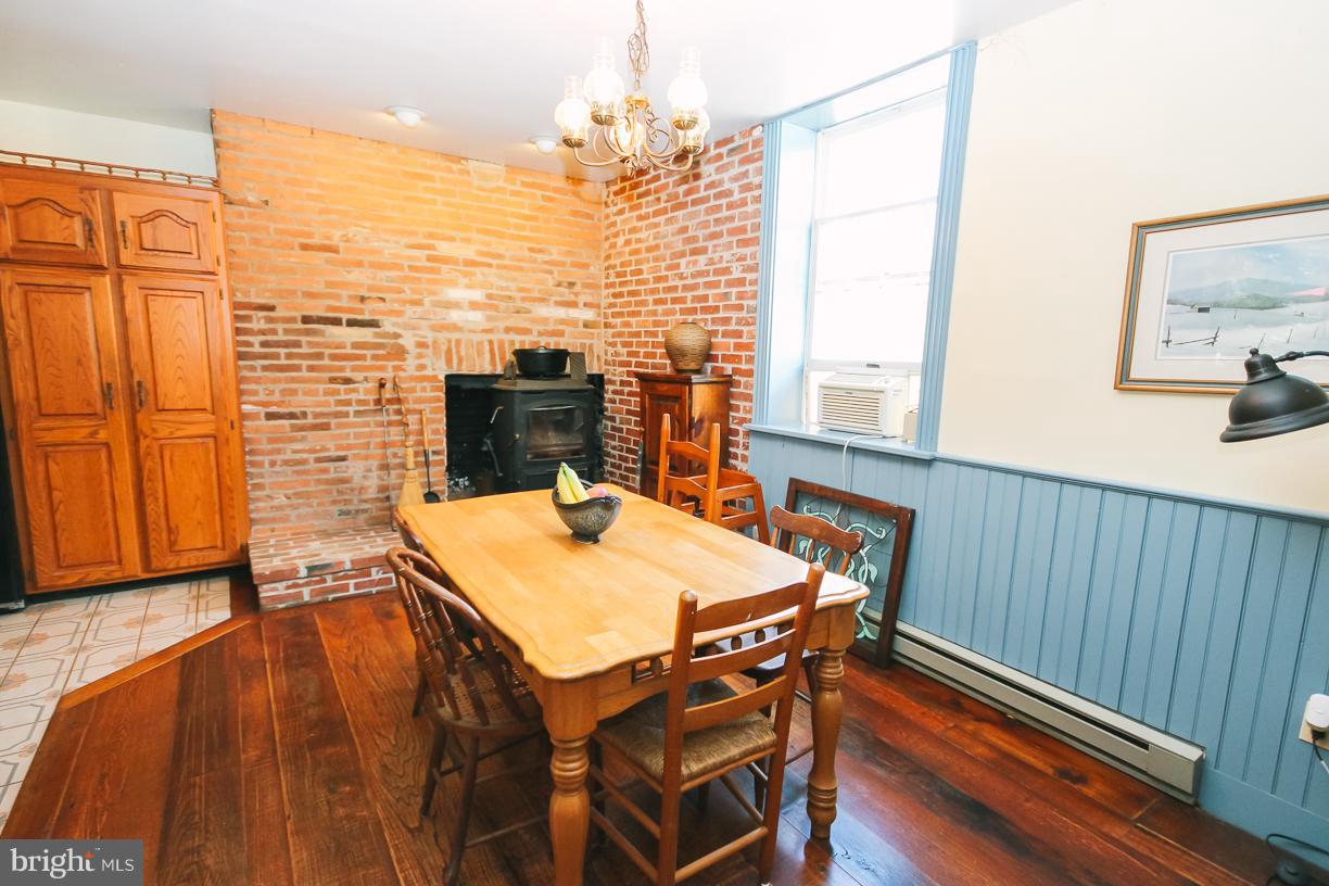 2943 Stone Road Westminster, MD 21158 - Photo 11 of 30 Breakfast area w/Fireplace (wood/coal stove stays)