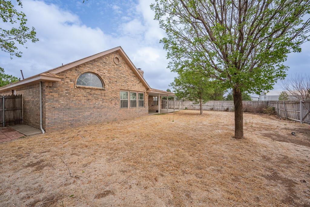 19933 Indian Spring Trail Bushland, TX 79124 - Photo 31 of 32 a front view of a house with a yard