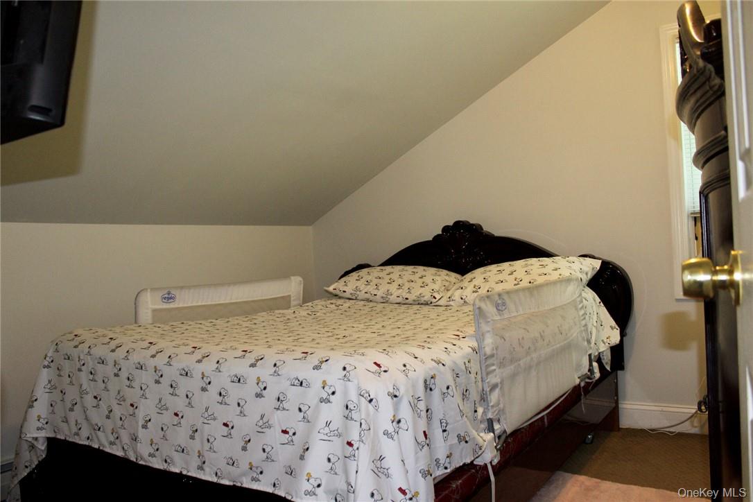 5834 Albany Post Road Cortlandt Manor, NY 10567 - Photo 10 of 14 Bedroom featuring lofted ceiling