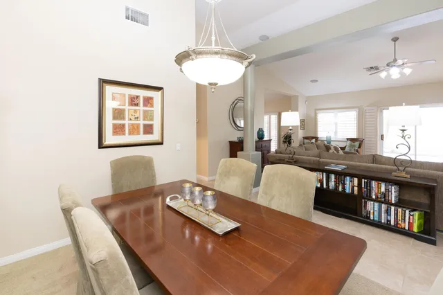 a spacious bathroom with a tub sink shower and mirror
