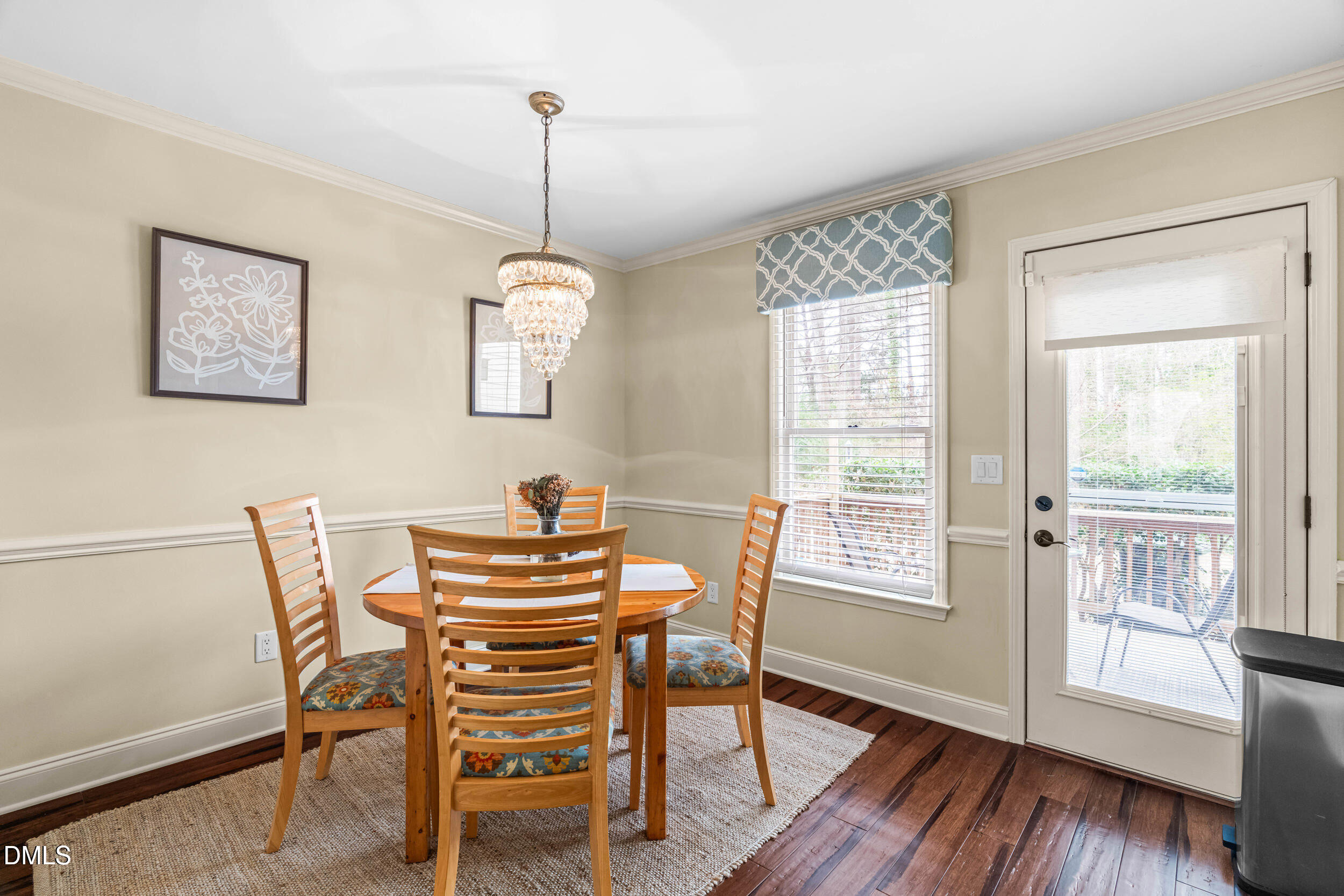 710 Powell Drive, Unit C Raleigh, NC 27606 - Photo 11 of 35 a view of a dining room with furniture window and wooden floor
