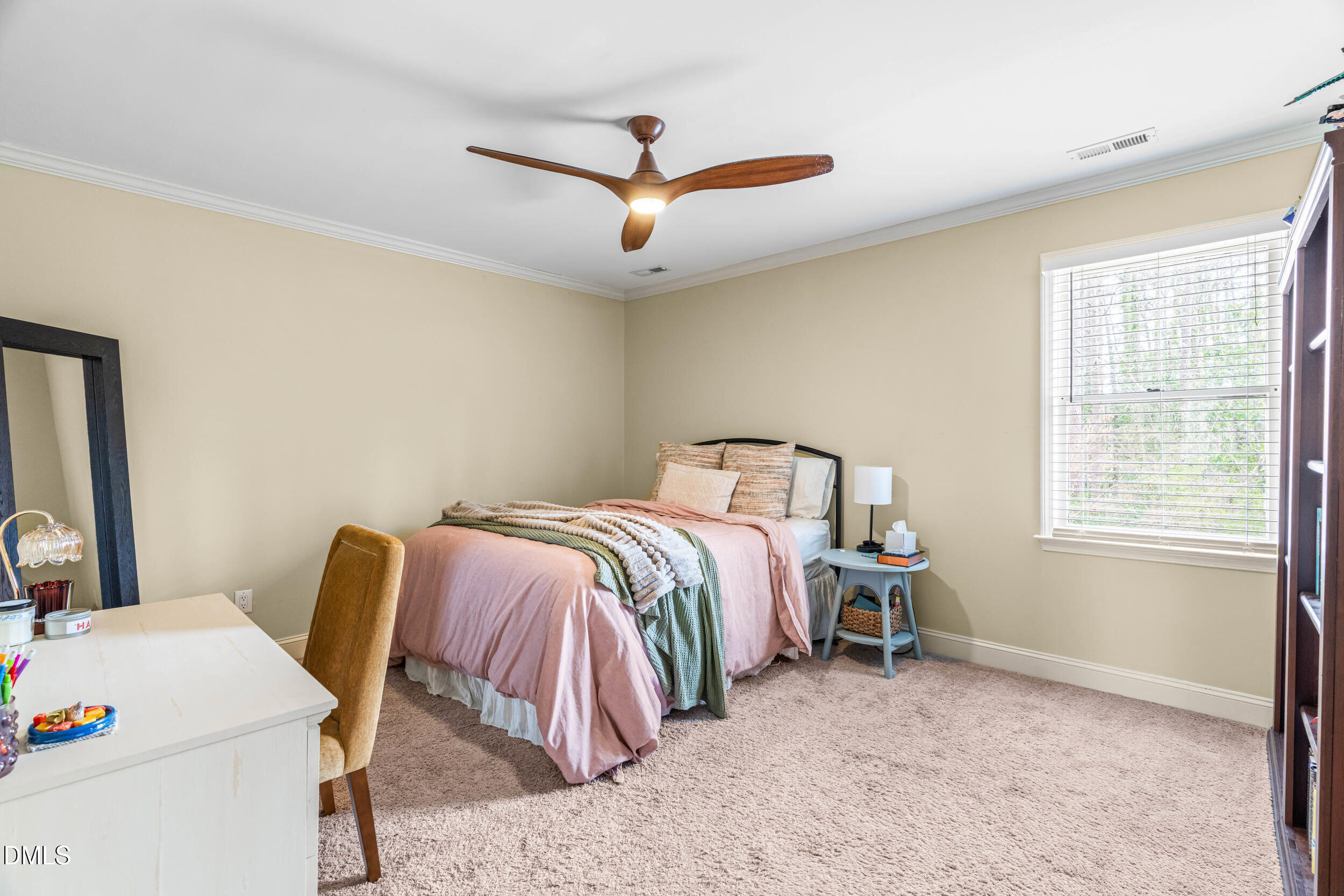 710 Powell Drive, Unit C Raleigh, NC 27606 - Photo 20 of 35 a bedroom with a bed and a window
