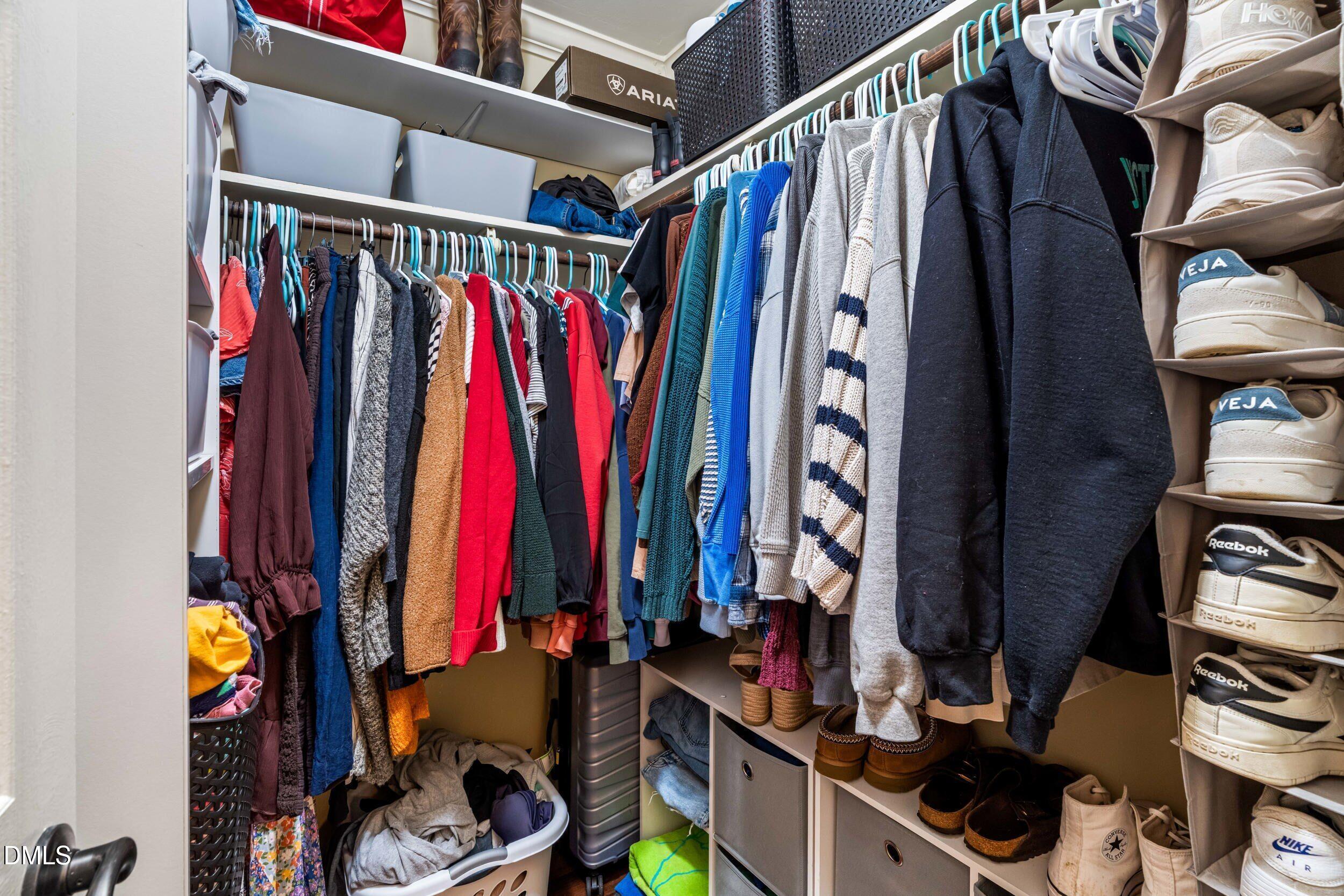 710 Powell Drive, Unit C Raleigh, NC 27606 - Photo 21 of 35 a view of walk in closet with clothes and shoes