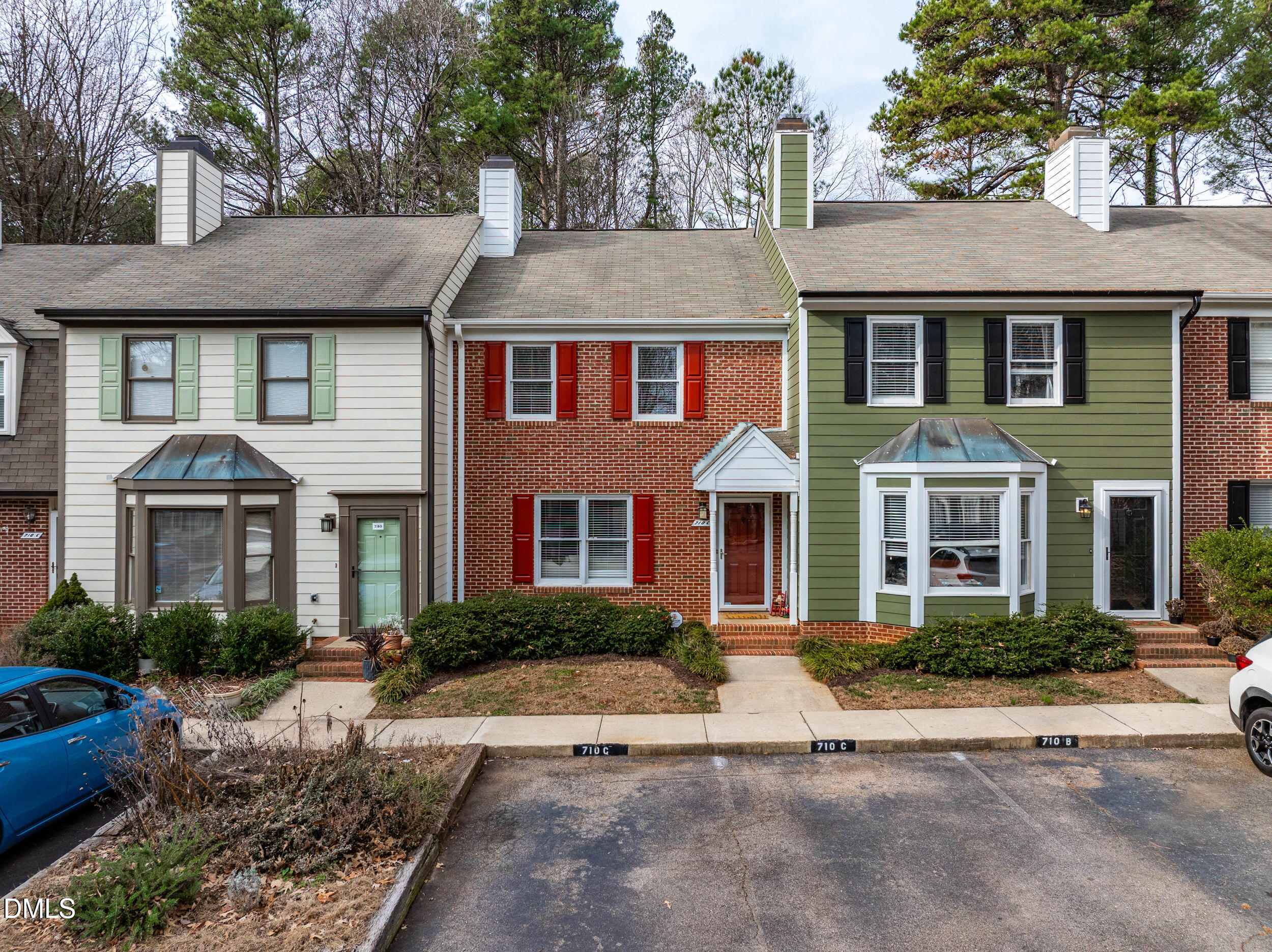 710 Powell Drive, Unit C Raleigh, NC 27606 - Photo 3 of 35 a front view of a house with a yard and trees