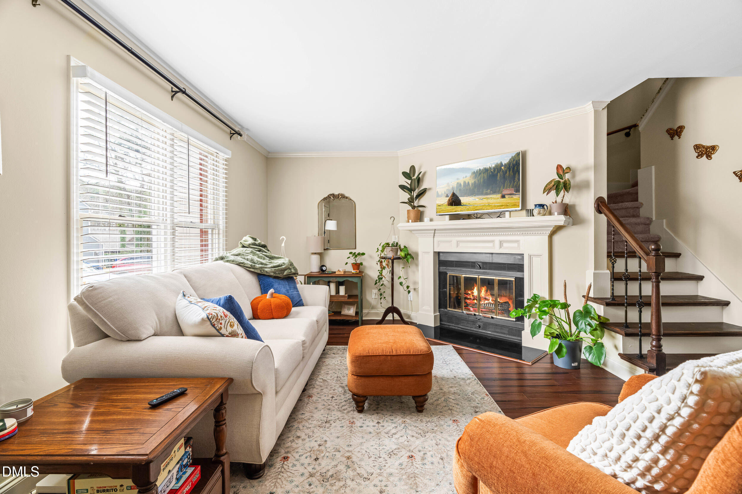 710 Powell Drive, Unit C Raleigh, NC 27606 - Photo 6 of 35 a living room with furniture fireplace and a large window