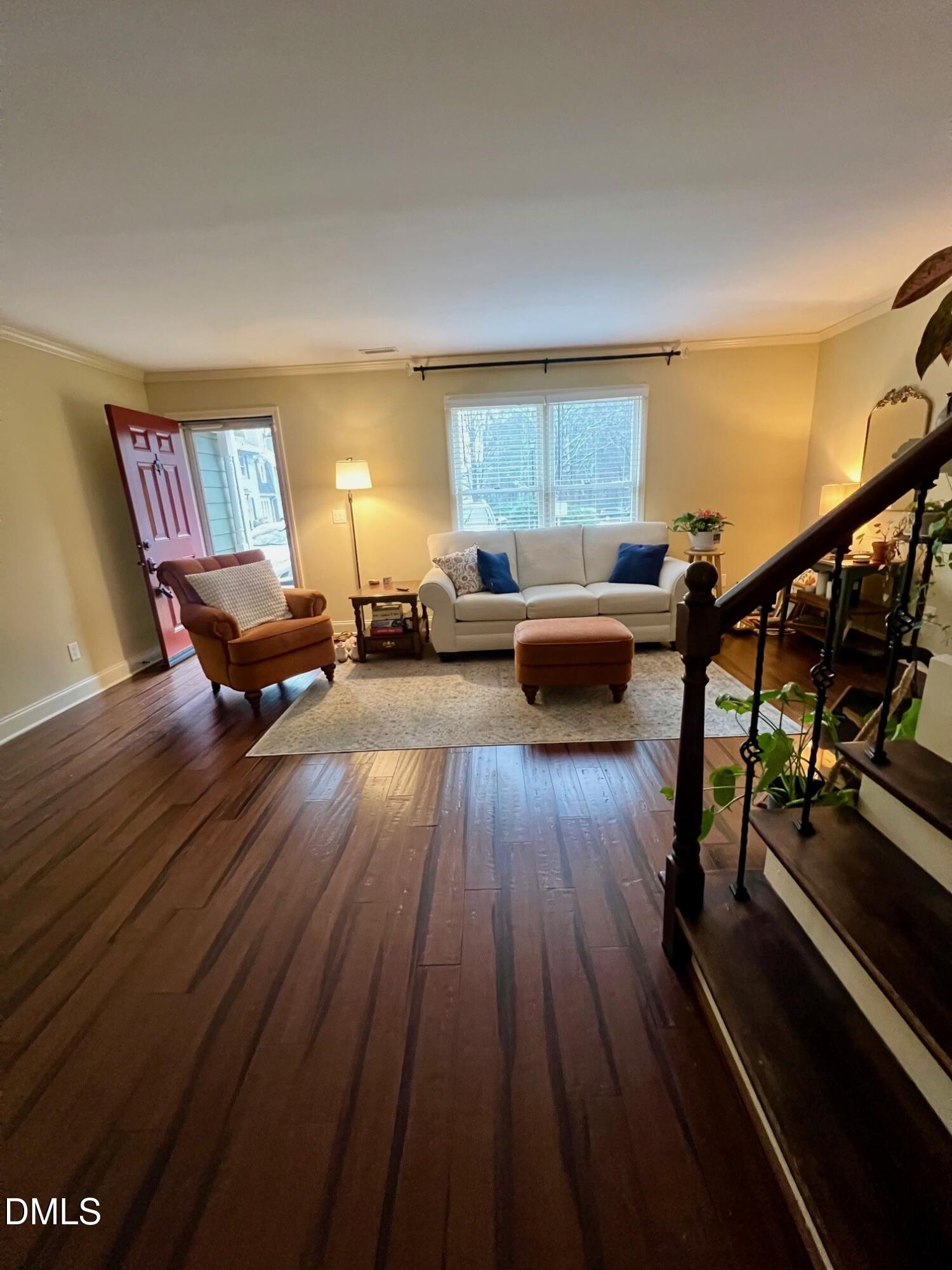 710 Powell Drive, Unit C Raleigh, NC 27606 - Photo 9 of 35 a living room with furniture and wooden floor