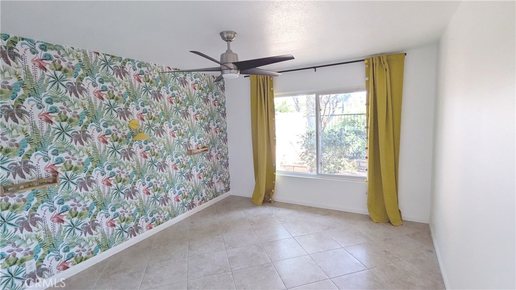 718 Vía La Paloma Riverside, CA 92507 - Photo 16 of 26 a view of entryway with window and wooden floor