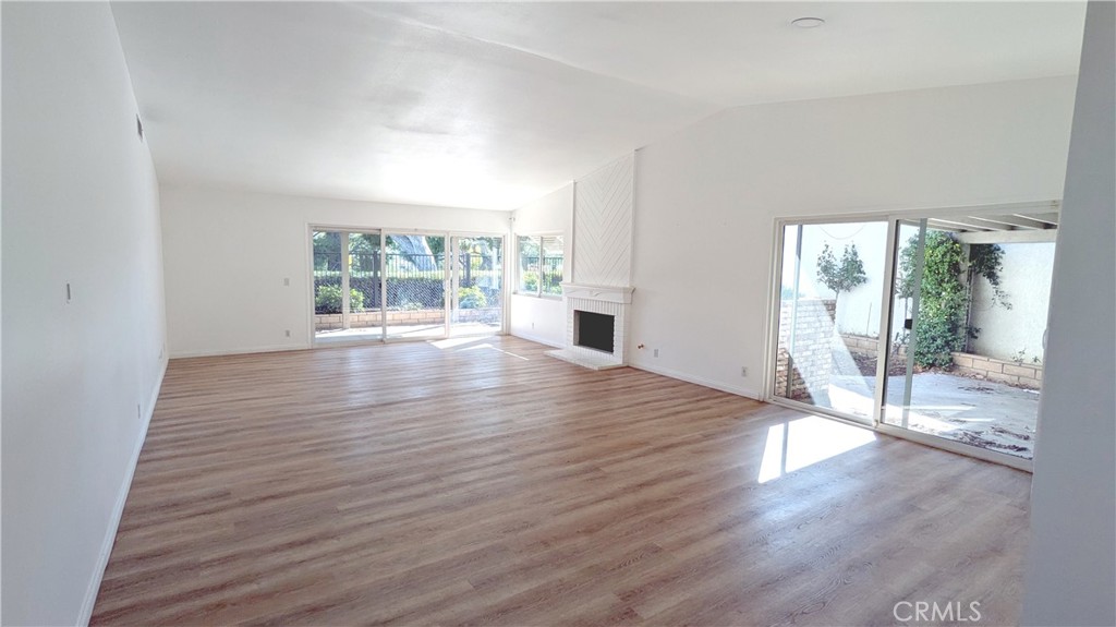 718 Vía La Paloma Riverside, CA 92507 - Photo 3 of 26 wooden floor in an empty room with a window