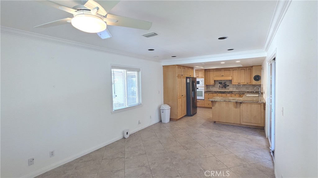 718 Vía La Paloma Riverside, CA 92507 - Photo 9 of 26 a view of a kitchen with a sink cabinets and a window