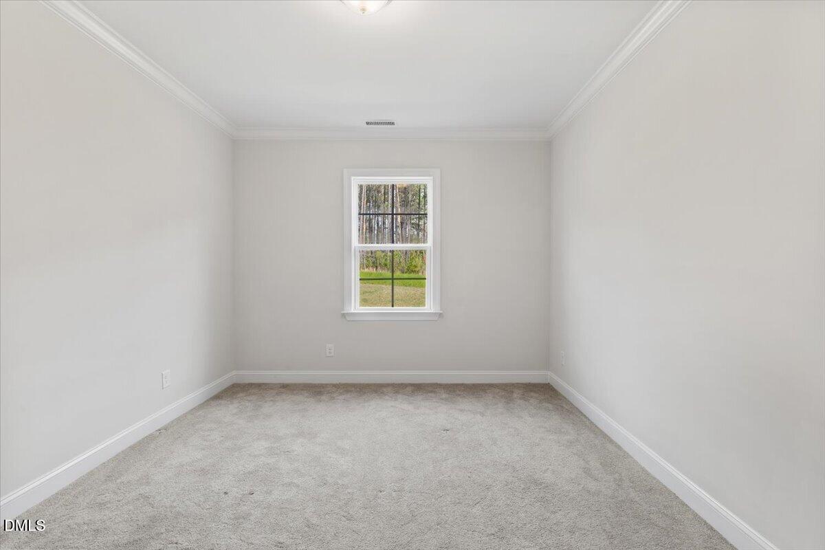 4937 Abundance Avenue Raleigh, NC 27616 - Photo 18 of 36 an empty room with a window