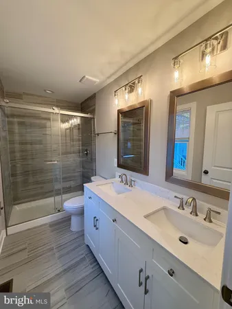 an empty room with a window and a ceiling fan