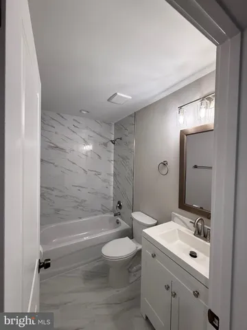 a view of an empty room and a window