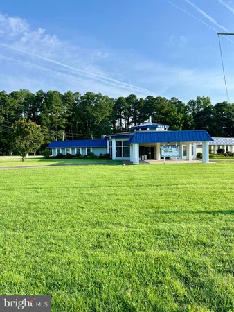a view of outdoor space with swimming pool and furniture