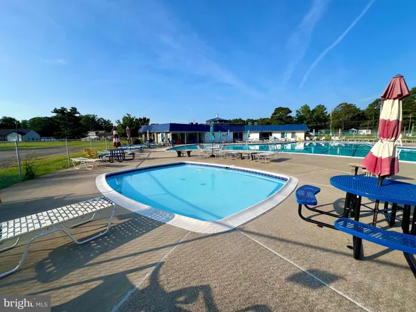 a view of a golf course with a building in the background
