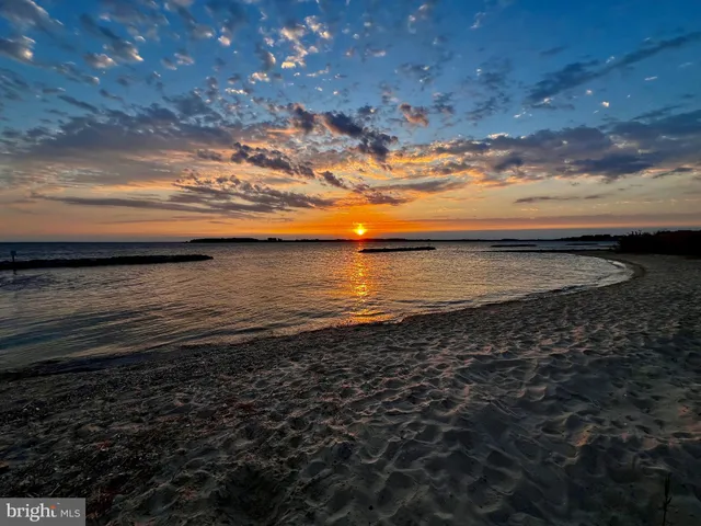 a view of outdoor space with wooden floor and seating