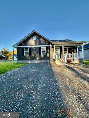 a kitchen with stainless steel appliances a refrigerator sink and microwave