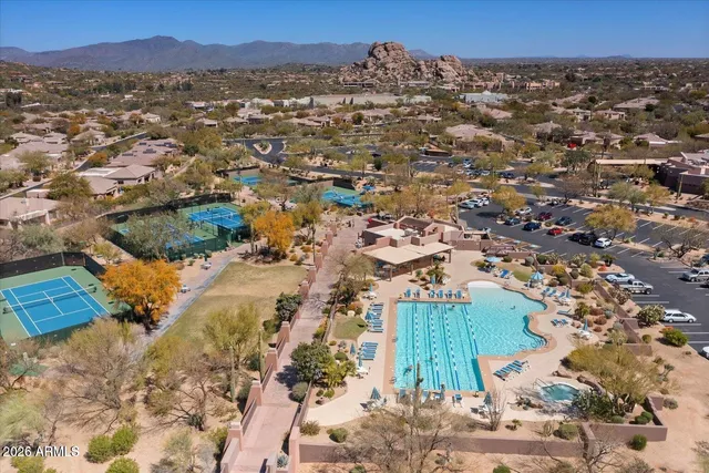 an aerial view of residential houses with outdoor space