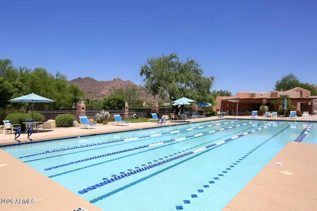 a view of swimming pool with outdoor seating
