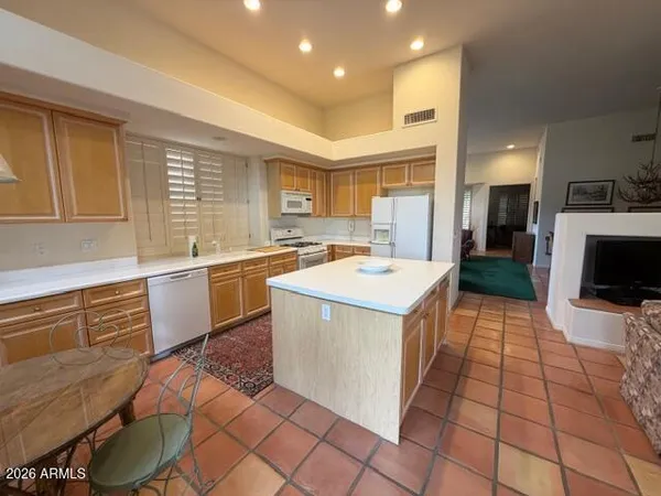 a kitchen with a sink appliances and cabinets