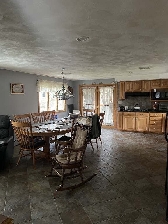 54 Charme Road Billerica, MA 01821 - Photo 4 of 23 a view of a dining room with furniture