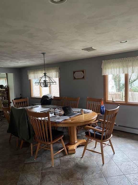 54 Charme Road Billerica, MA 01821 - Photo 6 of 23 a view of a dining room with furniture and window