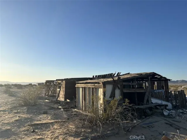 a view of a house with a yard and balcony
