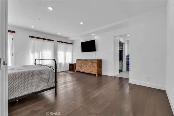a bedroom with a bed and a table in it