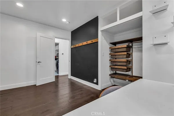 a kitchen with stainless steel appliances a stove and more cabinets