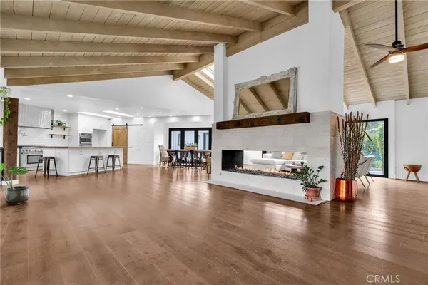 a view of a livingroom with furniture and a fireplace