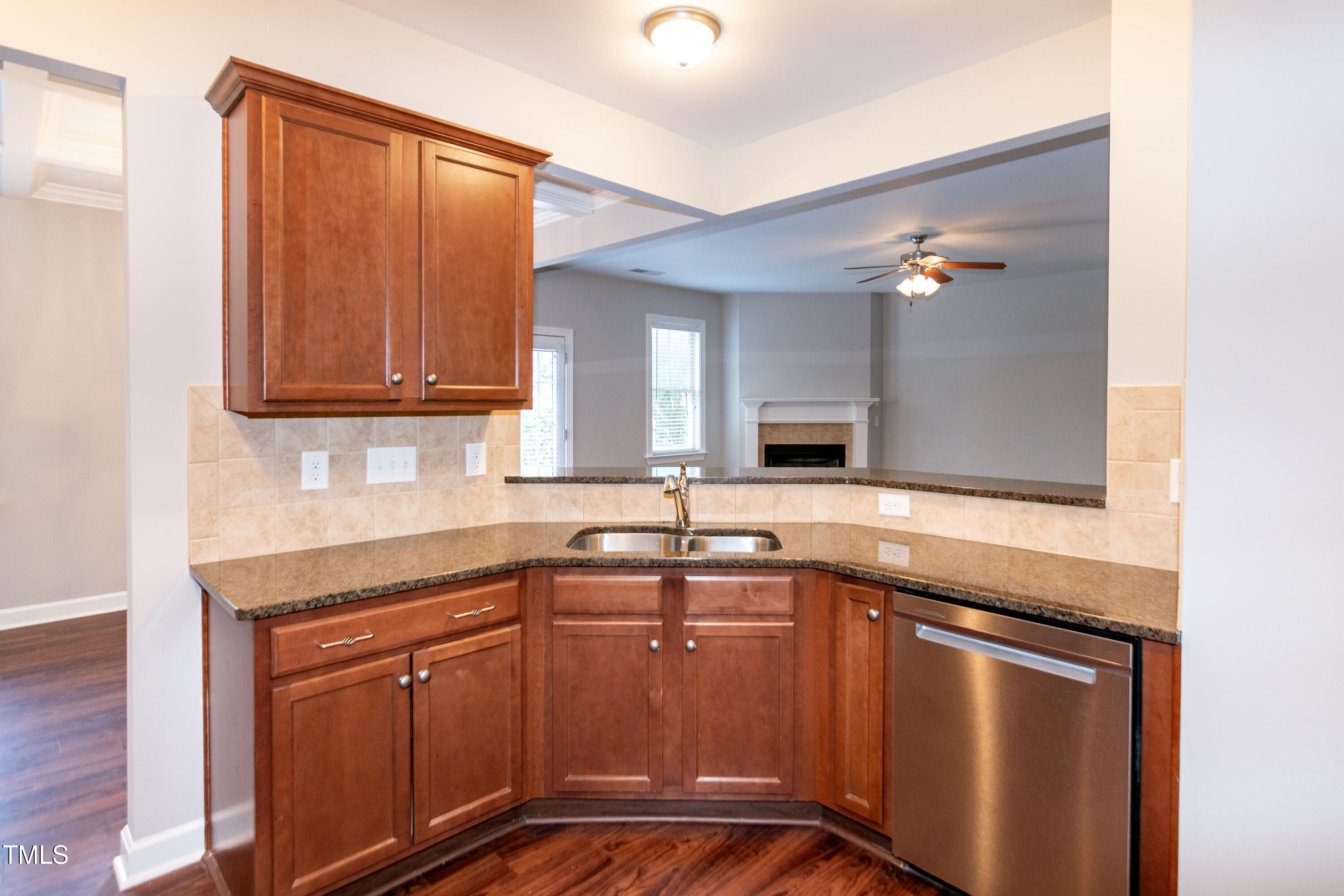 206 Roundhouse Lane Morrisville, NC 27560 - Photo 12 of 42 a kitchen with stainless steel appliances granite countertop a sink stove and cabinets
