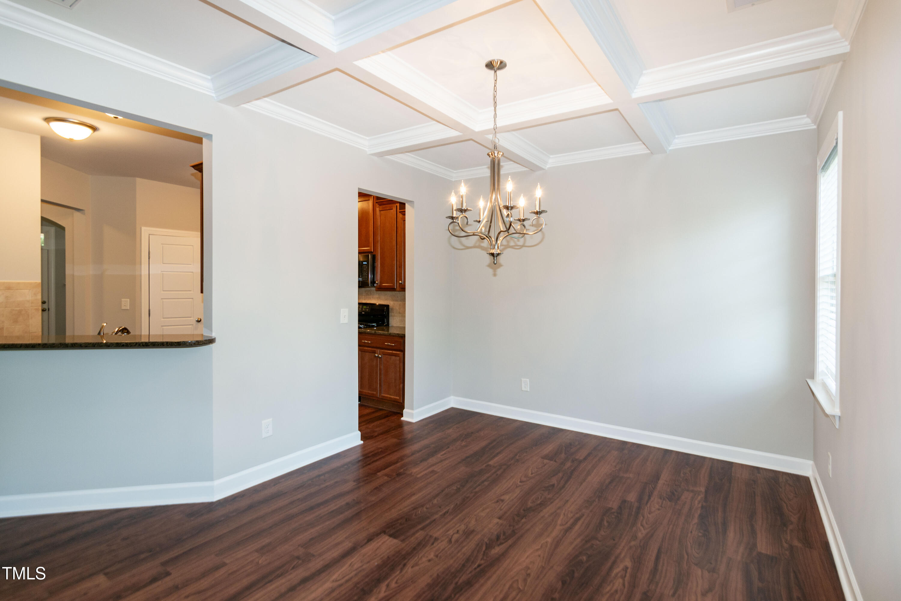 206 Roundhouse Lane Morrisville, NC 27560 - Photo 14 of 42 a view of a livingroom with wooden floor