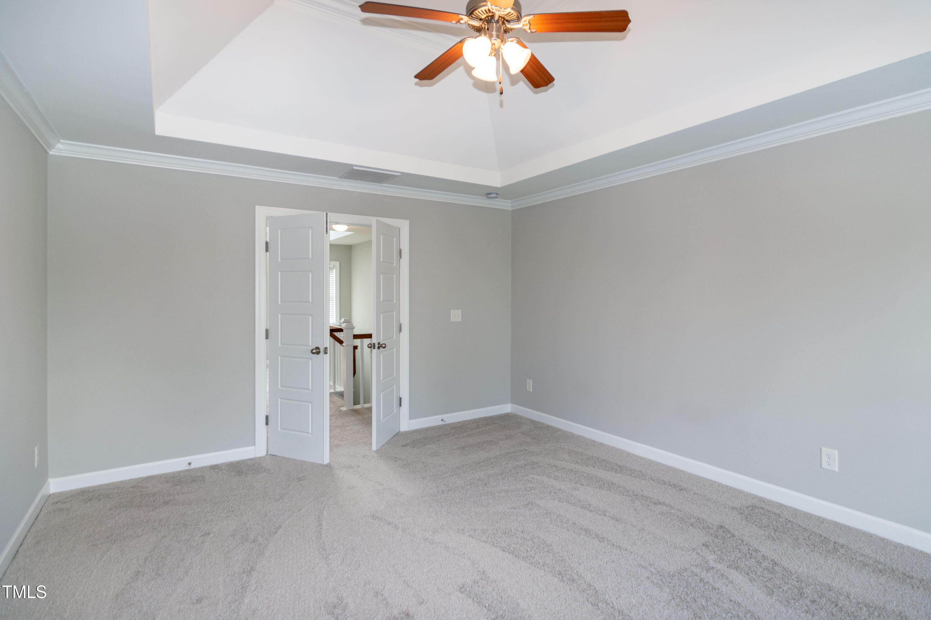 206 Roundhouse Lane Morrisville, NC 27560 - Photo 19 of 42 an empty room with a chandelier fan and closet