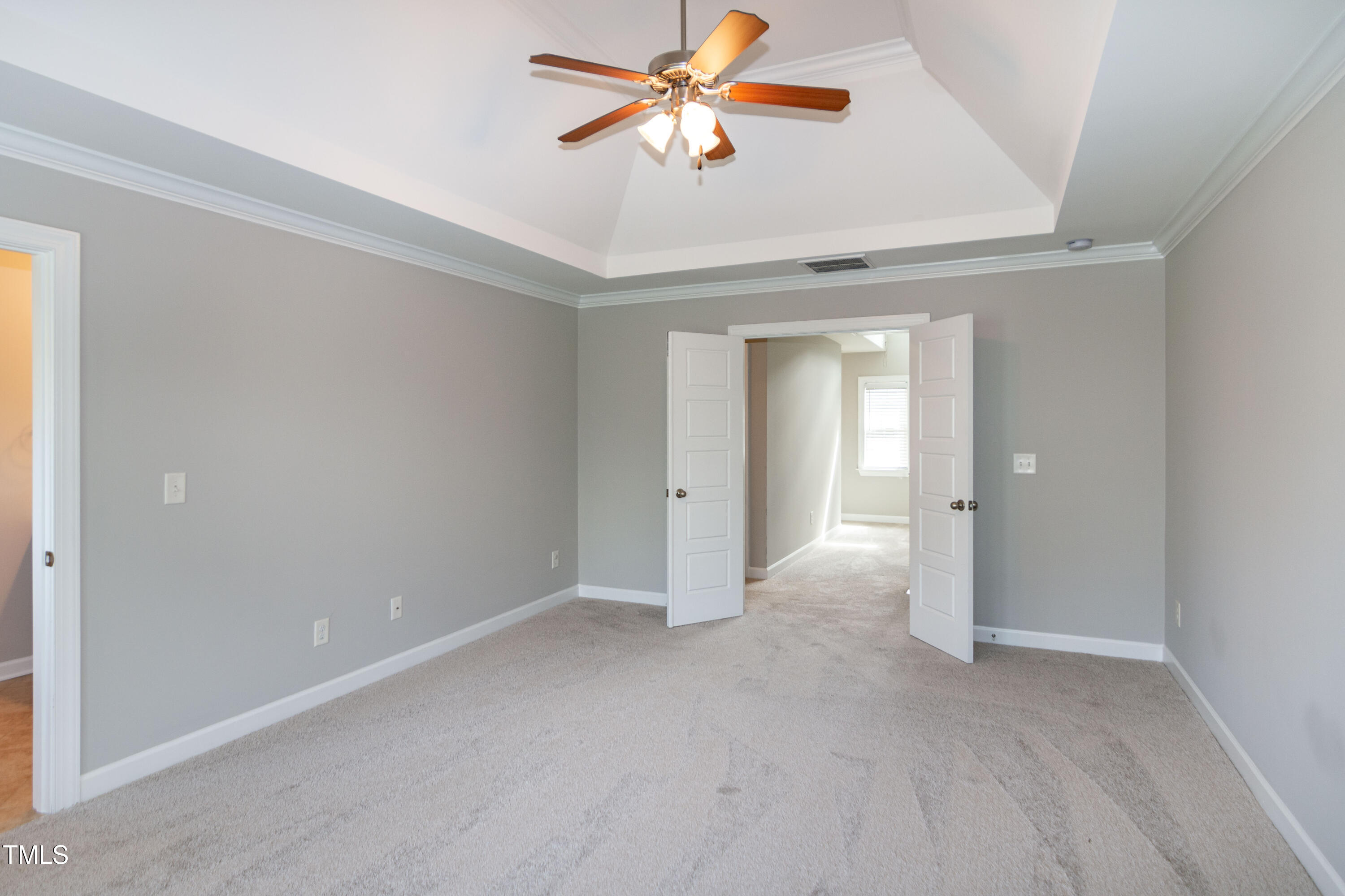 206 Roundhouse Lane Morrisville, NC 27560 - Photo 20 of 42 a view of a room with a ceiling fan and a window