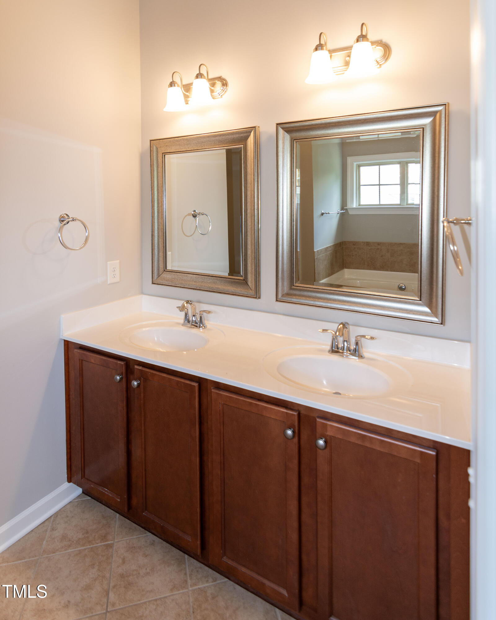 206 Roundhouse Lane Morrisville, NC 27560 - Photo 22 of 42 a bathroom with a double vanity sink and a mirror