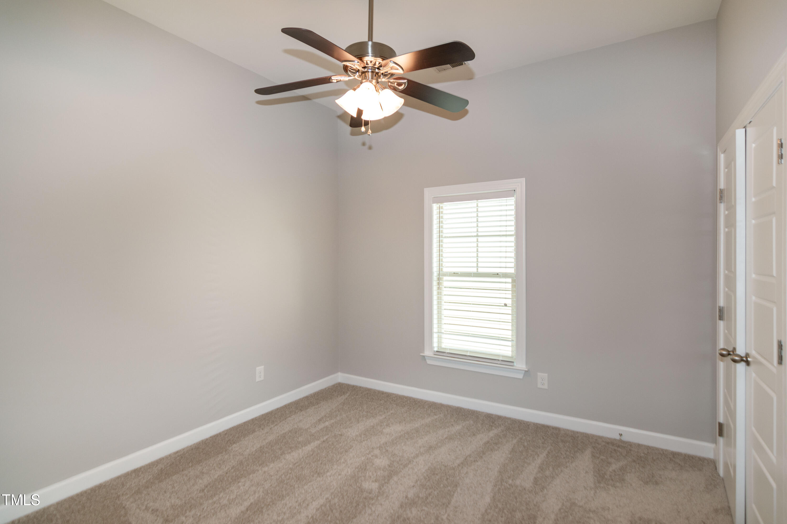 206 Roundhouse Lane Morrisville, NC 27560 - Photo 27 of 42 an empty room with windows and fan