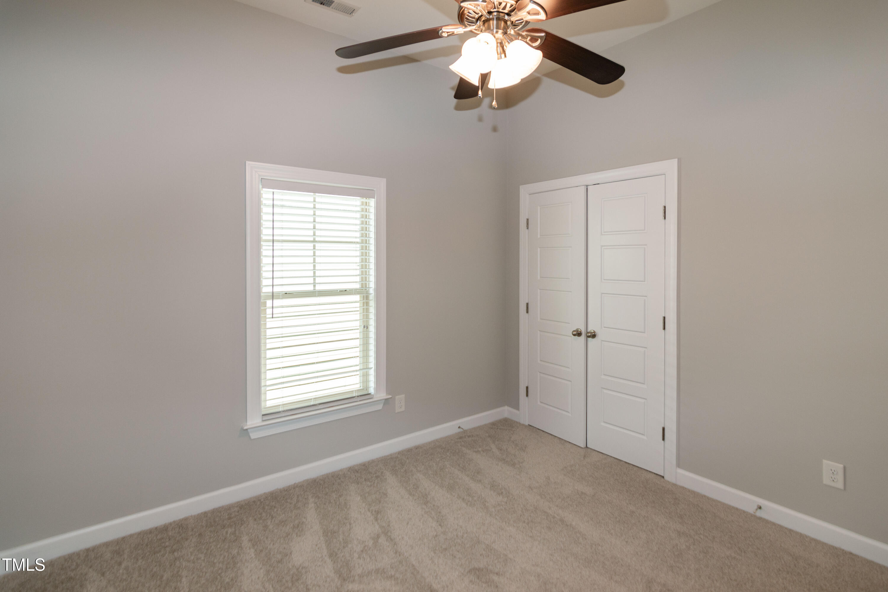 206 Roundhouse Lane Morrisville, NC 27560 - Photo 28 of 42 en empty room with windows and fan