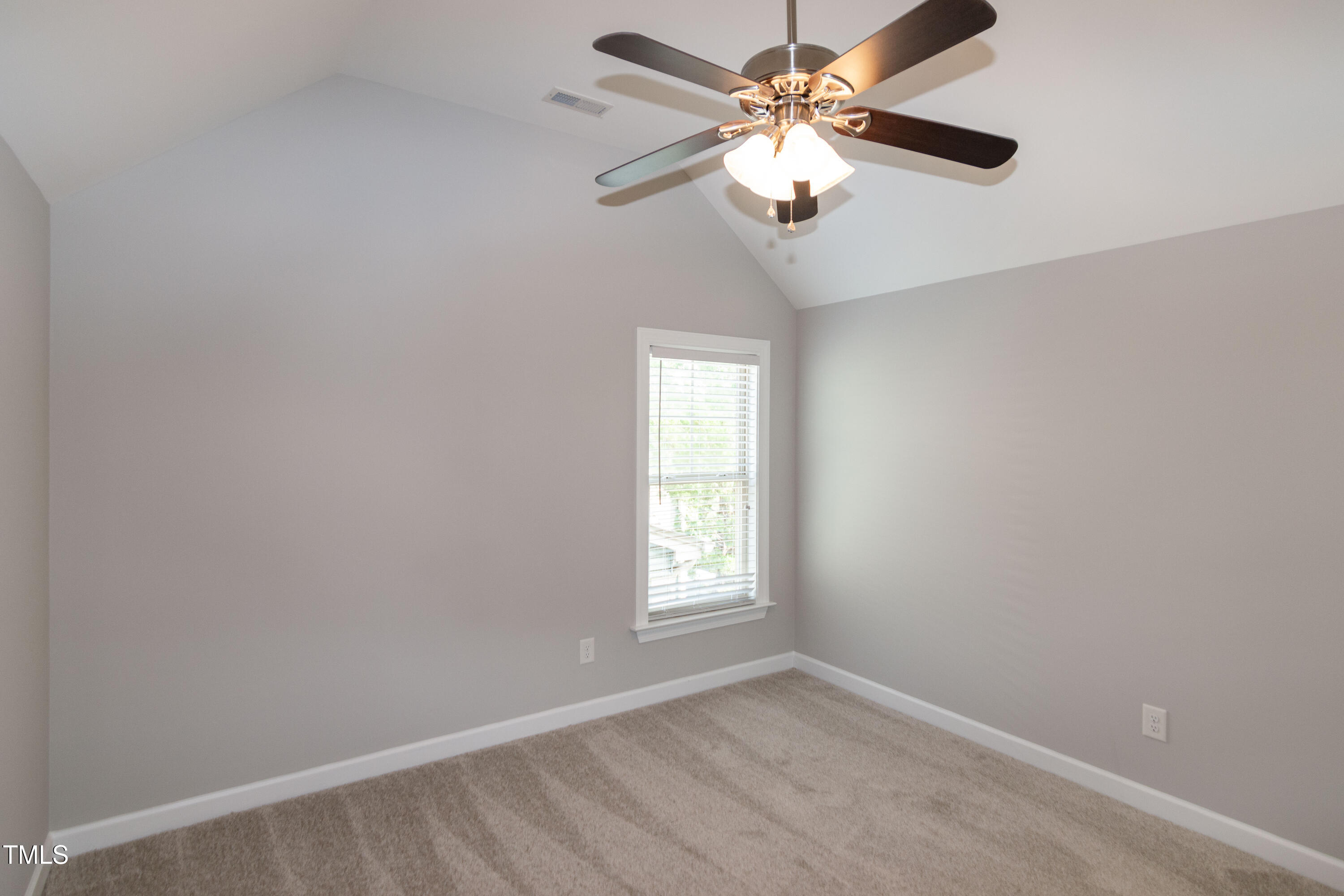 206 Roundhouse Lane Morrisville, NC 27560 - Photo 35 of 42 an empty room with windows and fan