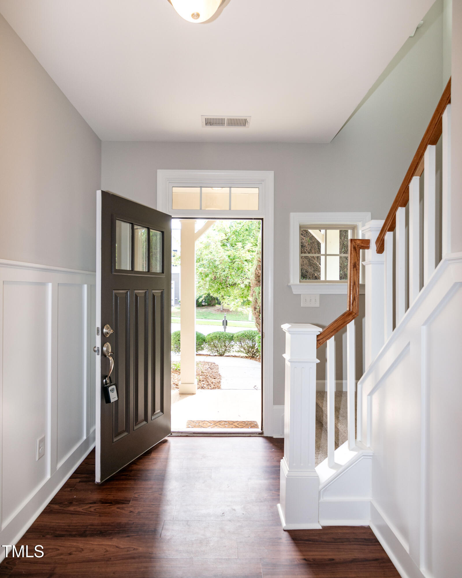 206 Roundhouse Lane Morrisville, NC 27560 - Photo 36 of 42 a view of an entryway with wooden floor and windows
