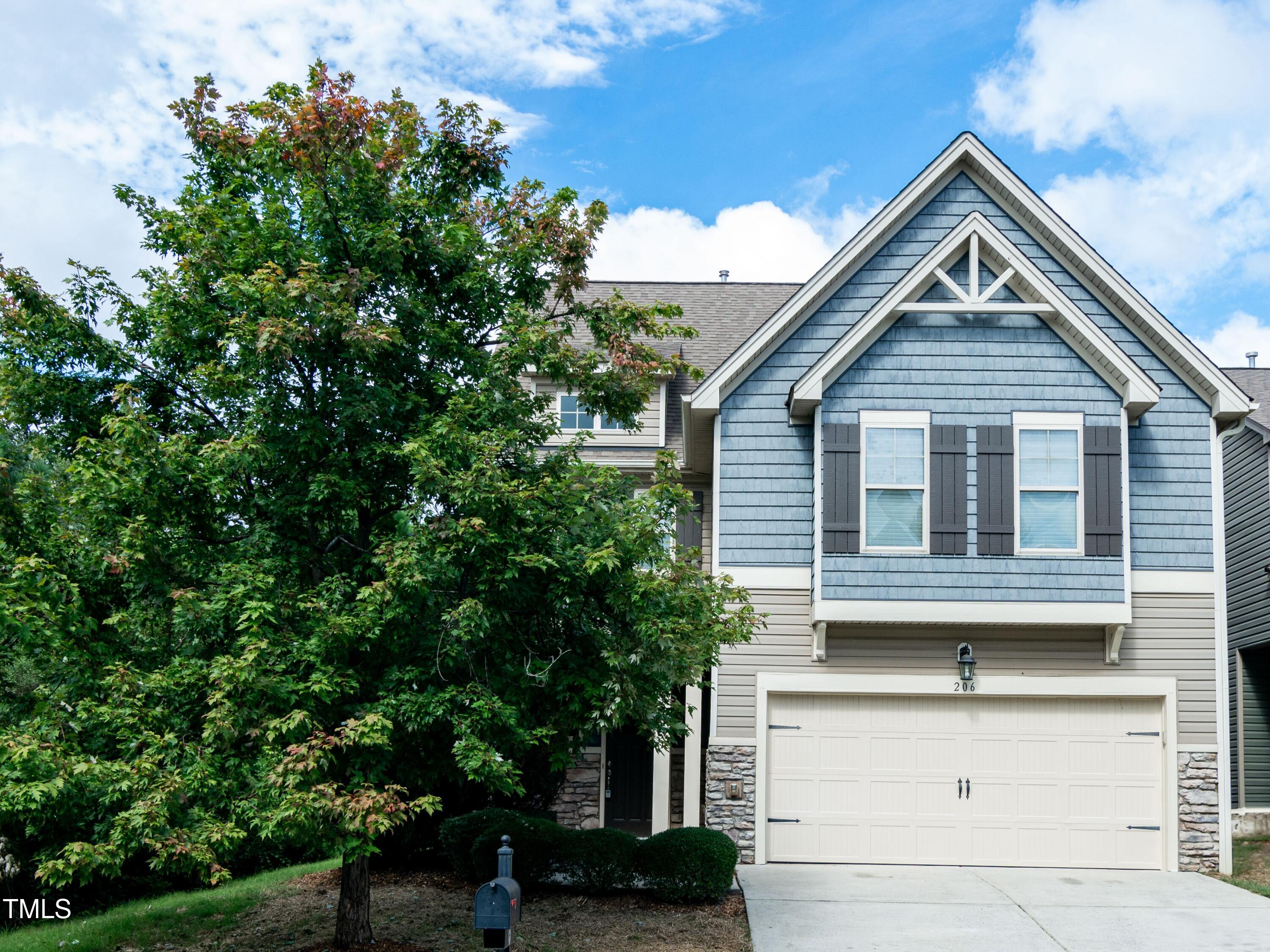 206 Roundhouse Lane Morrisville, NC 27560 - Photo 38 of 42 a house view with a garden space