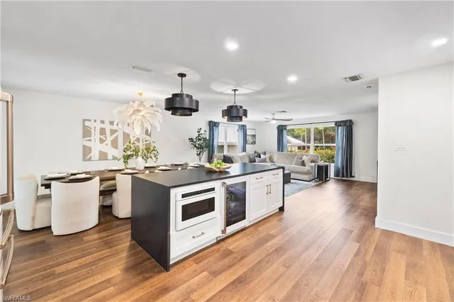 a kitchen with stainless steel appliances granite countertop a stove and a sink