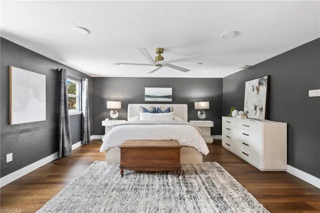 a bedroom with a bed and a dresser