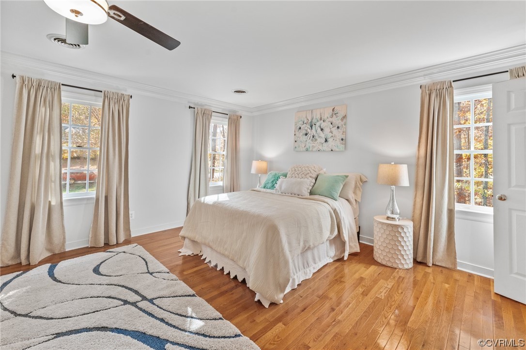 3430 Robious Forest Way Midlothian, VA 23113 - Photo 21 of 50 a bedroom with a large bed and a large window