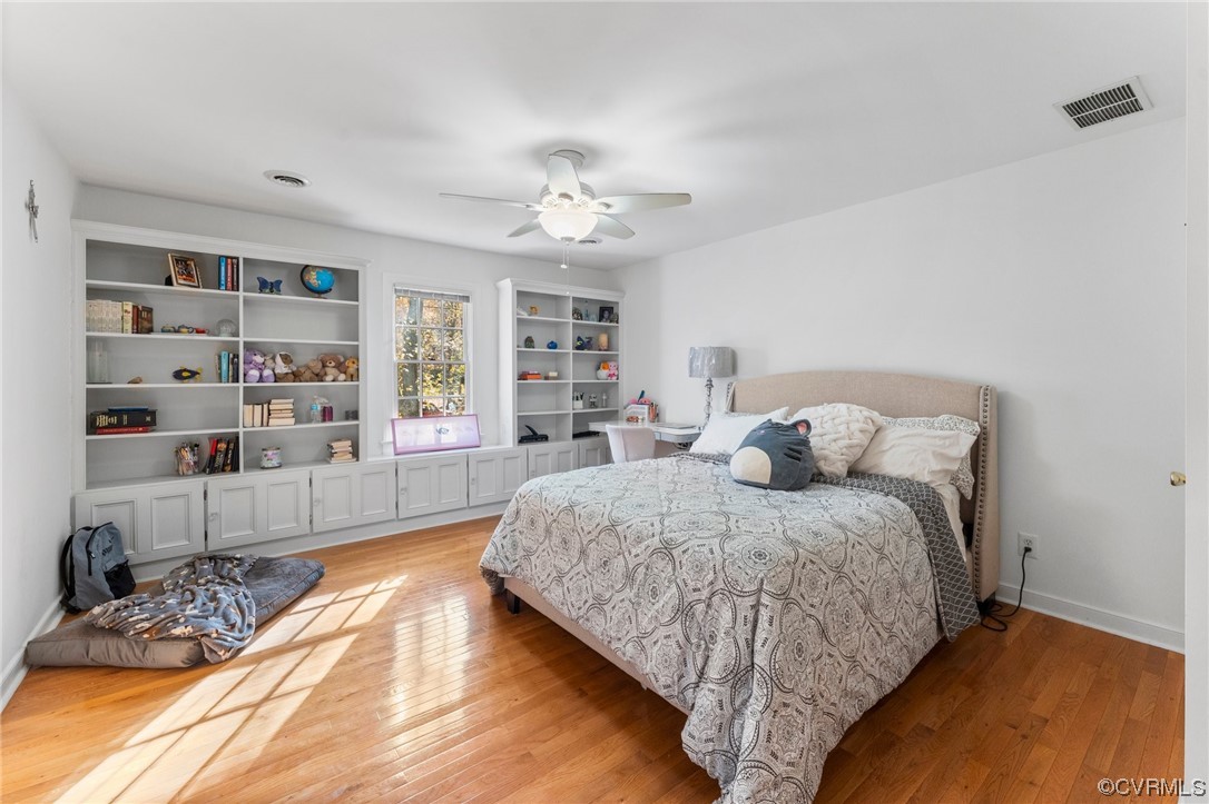 3430 Robious Forest Way Midlothian, VA 23113 - Photo 29 of 50 a spacious bedroom with a bed a dresser and a book shelf