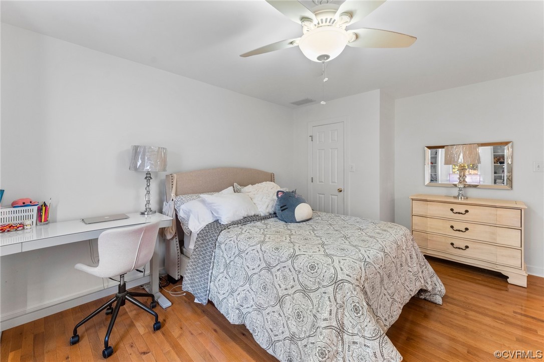 3430 Robious Forest Way Midlothian, VA 23113 - Photo 31 of 50 a bedroom with a bed and a chandelier