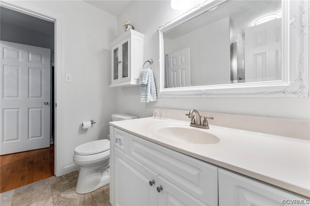 3430 Robious Forest Way Midlothian, VA 23113 - Photo 32 of 50 a bathroom with a sink a toilet and a mirror