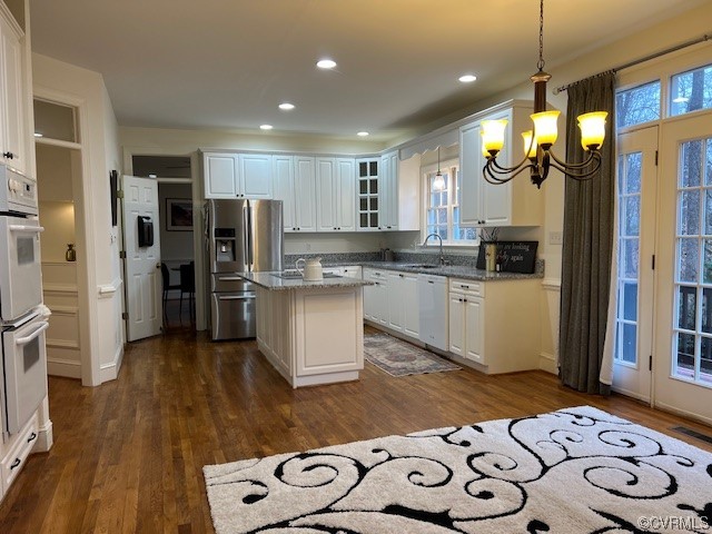 3430 Robious Forest Way Midlothian, VA 23113 - Photo 45 of 50 a kitchen with stainless steel appliances kitchen island granite countertop a refrigerator and a stove top oven